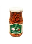 Selection of green olive slices with hot pepper in olive oil